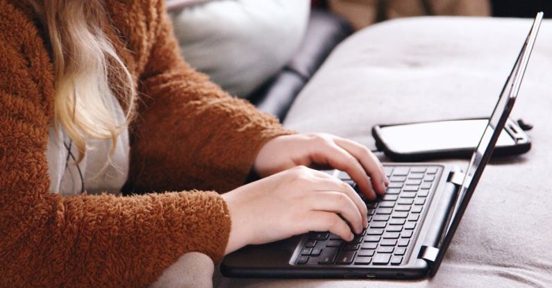 Special Education - Woman in Brown Sweater Using Laptop Computer