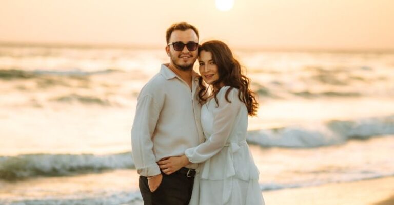 Water Scarcity - A couple standing on the beach at sunset